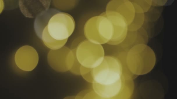 Fondo dorado, borroso, con luces bokeh. Los destellos abstractos. Bucle Full HD, 1080p — Vídeo de stock