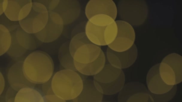 Golden, blurred, bokeh lights background. Abstract sparkles. Full HD loop, 1080p — Stock Video