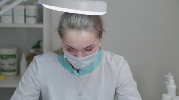 Closeup portrait of a female doctor at work. — Stock Video