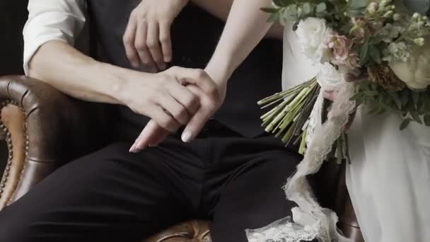 Happy newlyweds caress each others hands. — 비디오