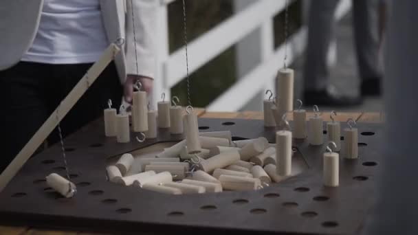 Guests play a board game in the fresh air. — Stock Video