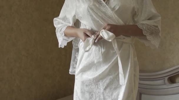 Beautiful hands of a girl in a white coat in a hotel room. — 图库视频影像