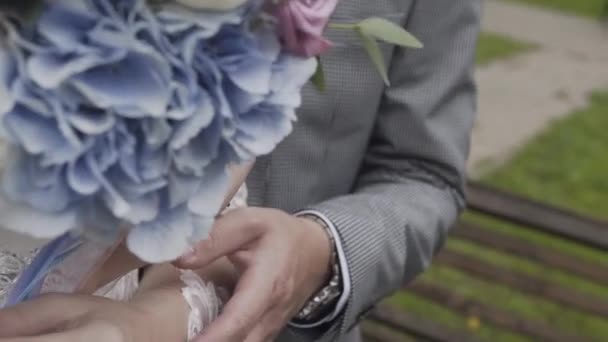 Happy newlyweds caress each other hands. — ストック動画