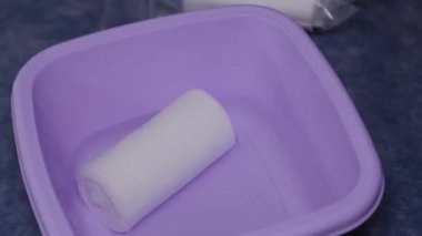 Female doctor wet a bandage in a special solution.