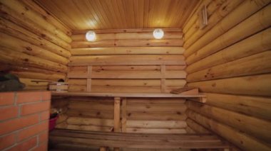 Beautiful sauna interior made of wooden logs.