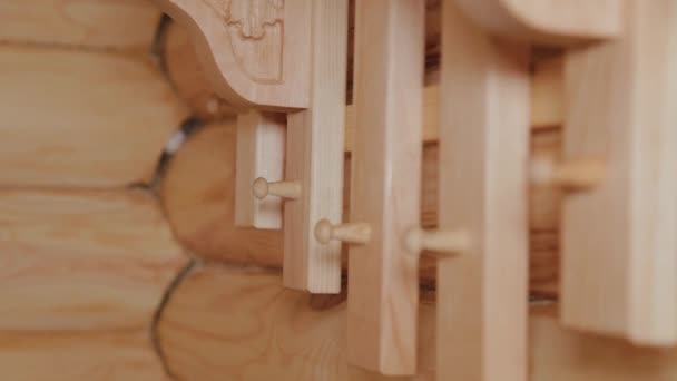 Beautiful carved wooden coat hanger. — Stok video