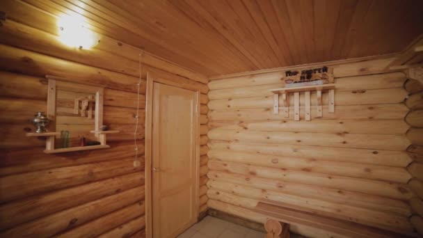 Beautiful interior of a wooden house from a log house. — Stok video