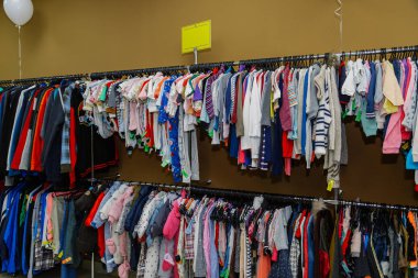 Shop interior with clothes hanging on a hanger.