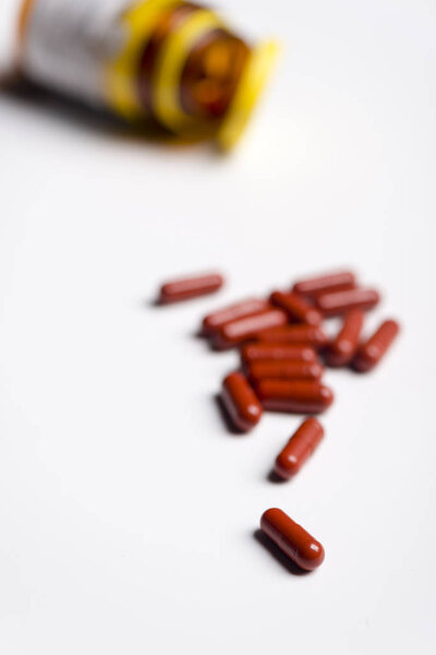 Pills over a white background