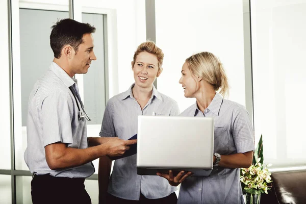 Young Doctor Consulting Two Attractive Nurses Private Hospital Stock Image