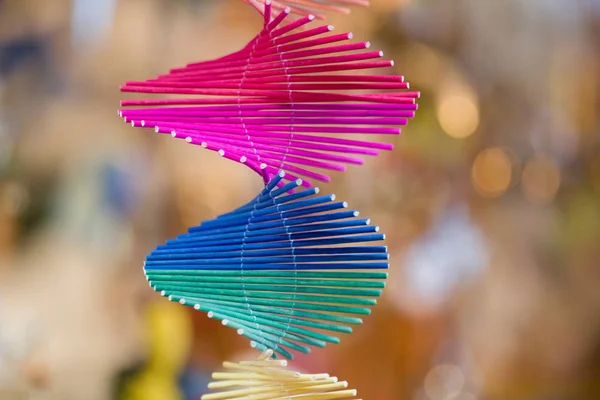 Multi colored spiral made from small wooden sticks — Stock Photo, Image
