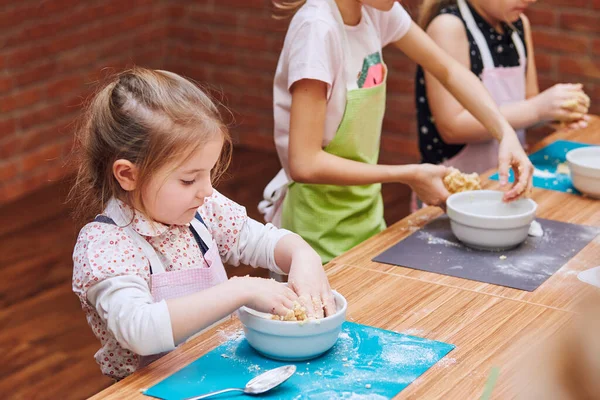 Little Girls Kneading Dough Baking Cake Kids Taking Part Baking Royalty Free Stock Images