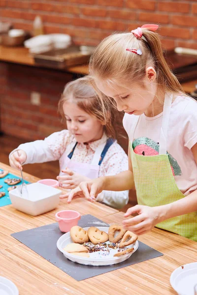 Little Girls Decorating Baked Cookies Colorful Sprinkle Icing Sugar Kids Stock Image