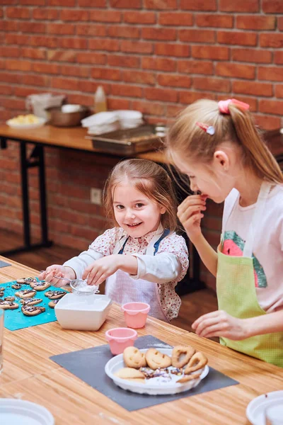 Little Girls Decorating Baked Cookies Colorful Sprinkle Icing Sugar Kids Stock Image