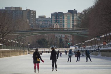 Ice skating on the frozen Rideau Canal Winterlude, Ottawa Feb 8, 2017 clipart