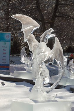 Dragon Ice Sculpture Carving at Winterlude, Ottawa, Feb 8, 2017 clipart