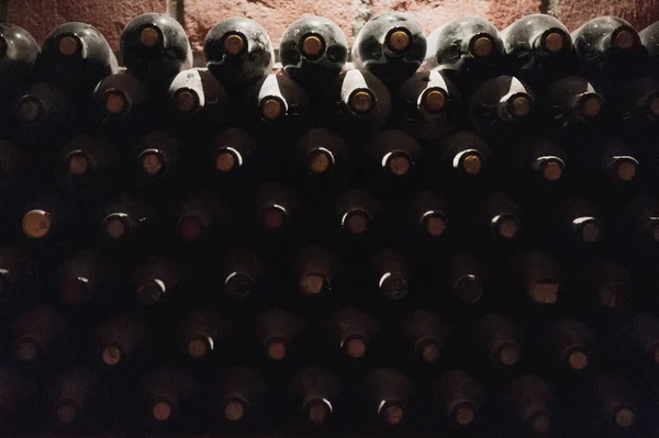 Dusty bottles with wine in Kvareli wine tunnel — Stock Photo, Image