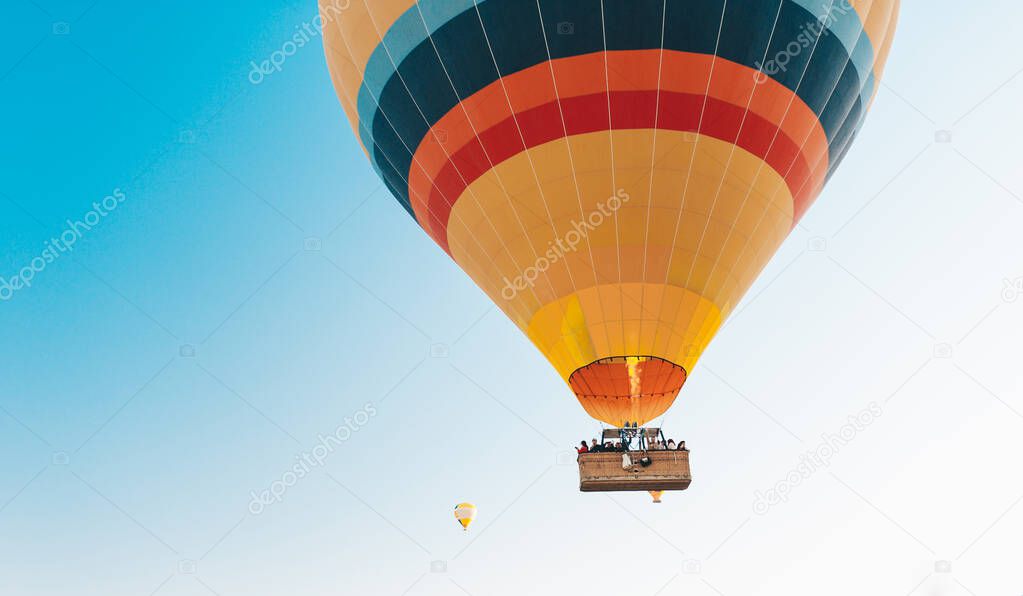 Hot air balloon against the blue sky. Cappadocia, Turkey