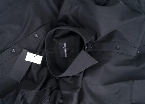 Новый черный цвет рубашки и бланк этикетки — стоковое фото