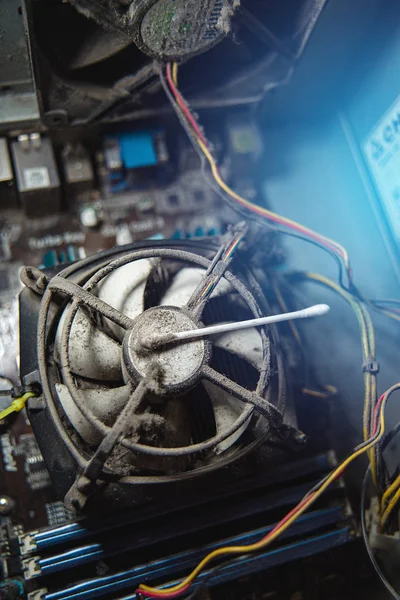 Dust on computer pc processor cooler with mainboard and computer case fragment. — ストック写真