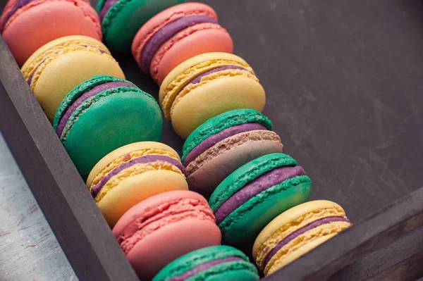 Sweet macarons on retro dark background. Top view, Holiday time Bakery concept. — Stock Photo, Image