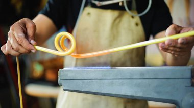 glass blower making neon tube, Concept of craftsmanship clipart