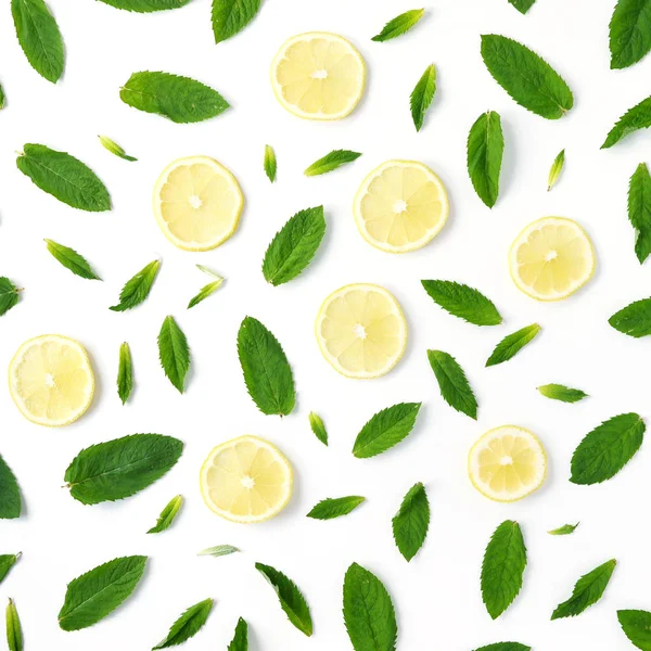 Pattern of mint and lemon. Food background with citrus. Mint leaves, lemon slices isolated on white background. Top view, flat lay