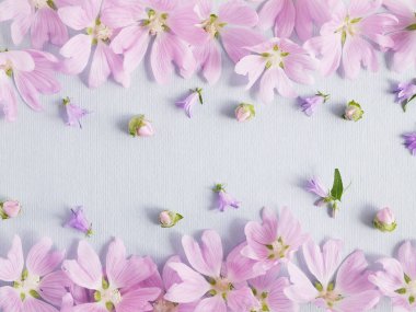 Floral composition with lilac hollyhocks on light background clipart