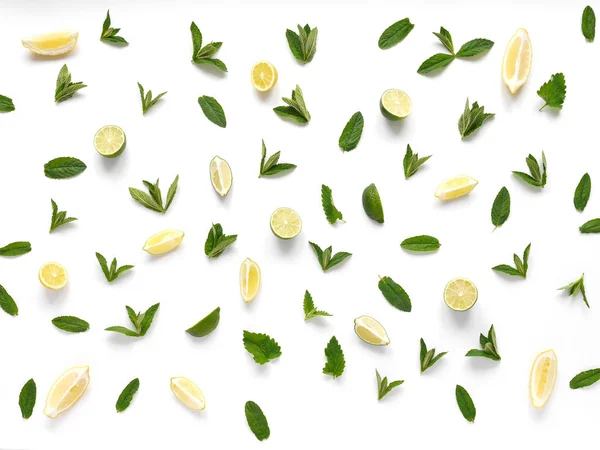 Top view of mint leaves and lime and lemon slices isolated on white background