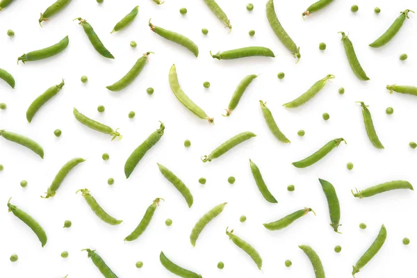Top view of composition with snow peas and peas on white background