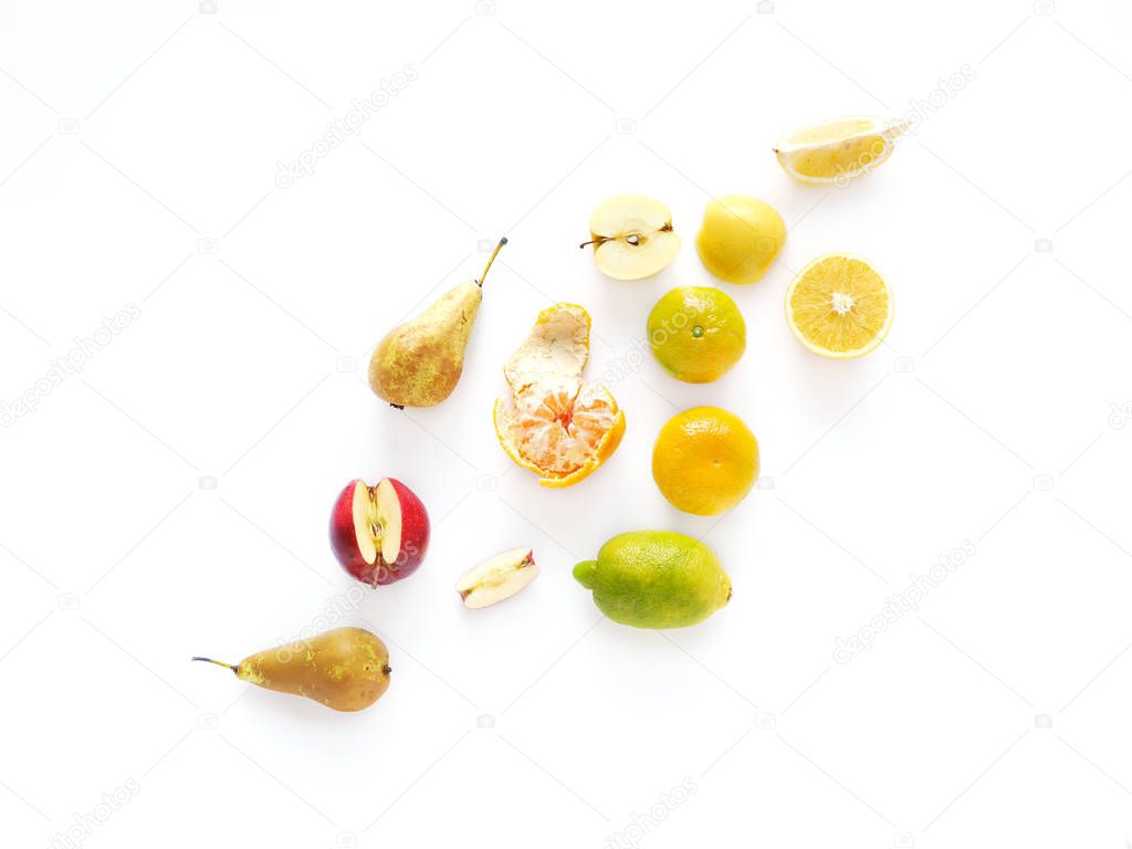 Top view of sliced orange, lemon, tangerine, apple isolated on white background 