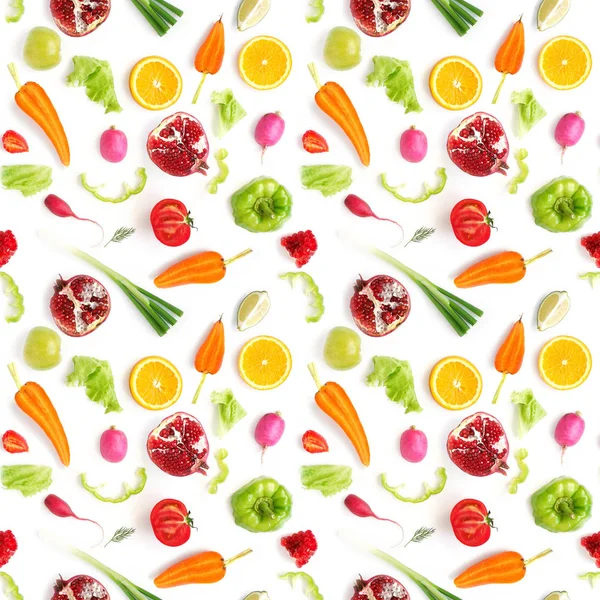 Vegetable composition with parted carrots, garnets, strawberries, tomatoes, sliced peppers, green leaves, oranges, limes ana whole young onions, radishes on white background