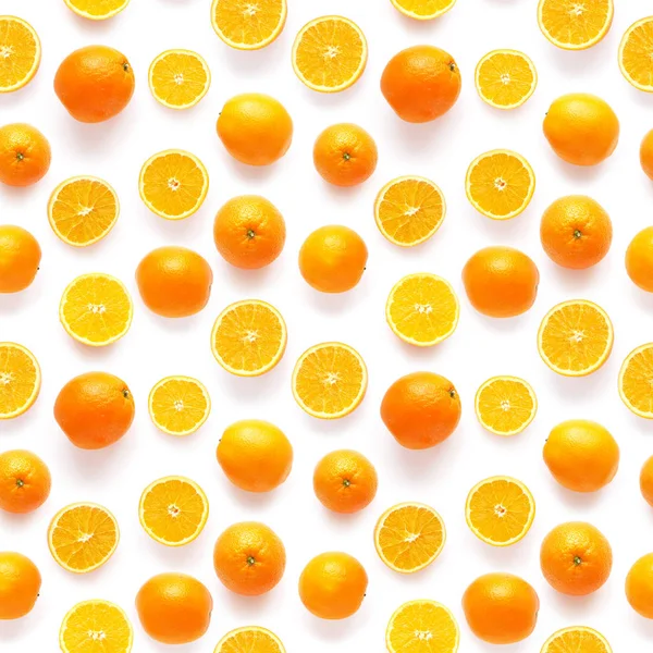 Composition of whole and sliced oranges on white background