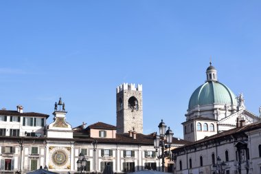 Skyline of Piazza della Loggia in Brescia with the dome of the C clipart