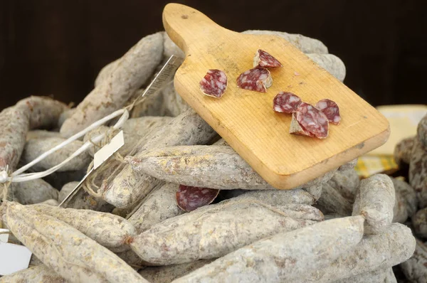 Salami exposed in a gastronomic festival in the village of Iseo — Stock Photo, Image