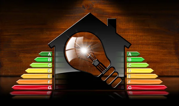 Energieeffizienz - Musterhaus und Glühbirne — Stockfoto