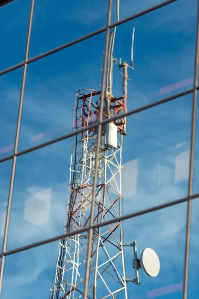 Telecommunication Tower Reflected on Glasses — Stock Photo, Image