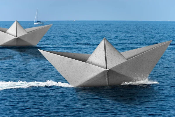 White paper boats runs fast over the blue sea with wake — Stock Photo, Image