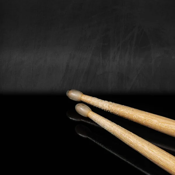 Wooden used drumsticks on a blackboard with reflections — 스톡 사진
