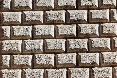 Ashlar (Bugnato in Italian), closeup of a wall made of big blocks of stones in Trento city, Trentino Alto Adige, Italy, Europe clipart