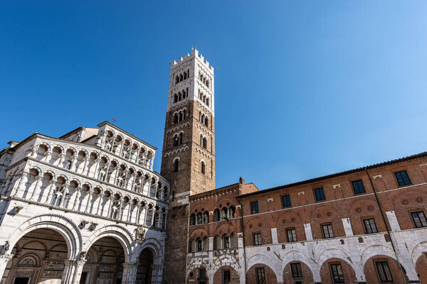 Lucca, facade and bell tower of the Cathedral of San Martino (Saint Martin), in Romanesque Gothic style, XI century. Tuscany, Italy, Europe