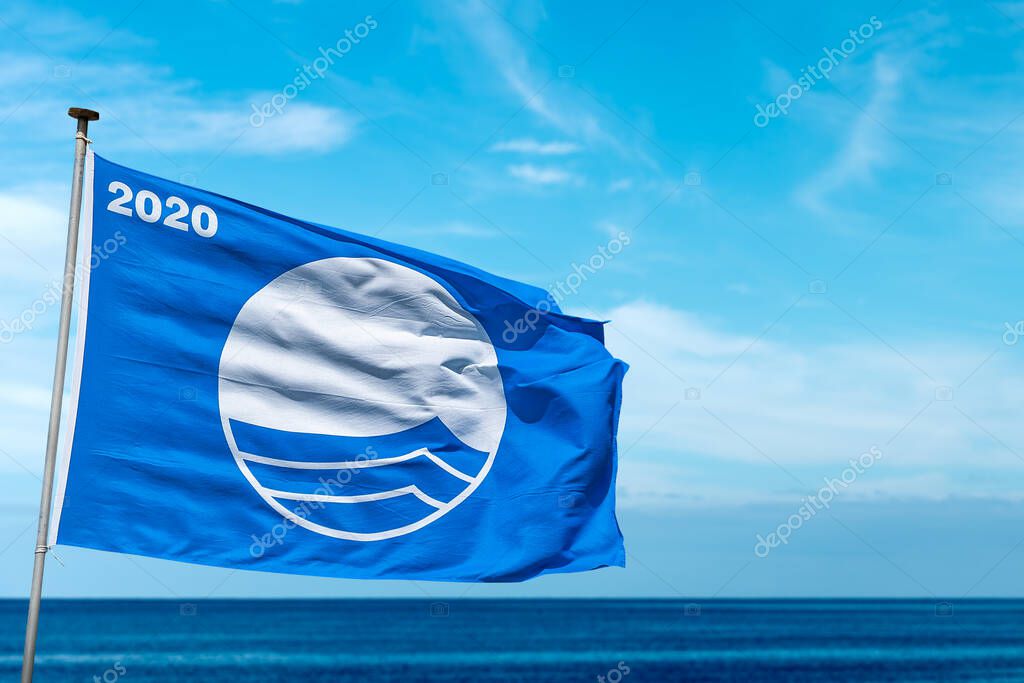 LERICI, LIGURIA, ITALY - MAR 8, 2020: Blue Flag beach 2020, symbol of high quality of coastal resorts with clean beaches and sea. FEE (Foundation for Environmental Education)