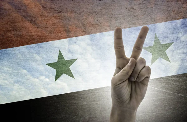 Sejrssymbol - to fingre på baggrund af Syriens flag - Stock-foto