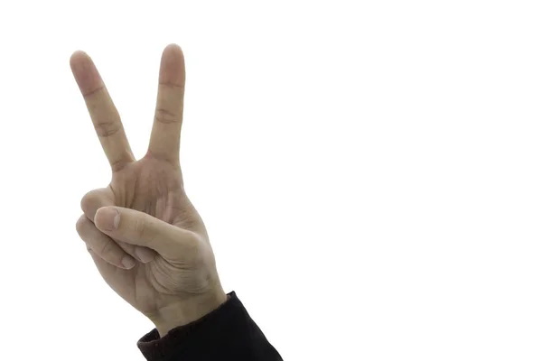 Два пальца показывают знак победы на фоне серого неба — стоковое фото