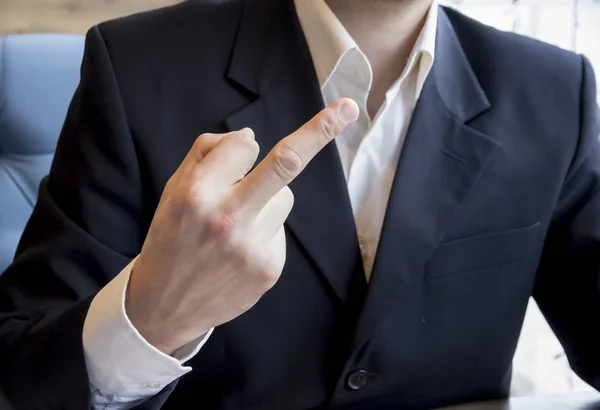 Man in business suit showing middle finger fuck — Stock Photo, Image