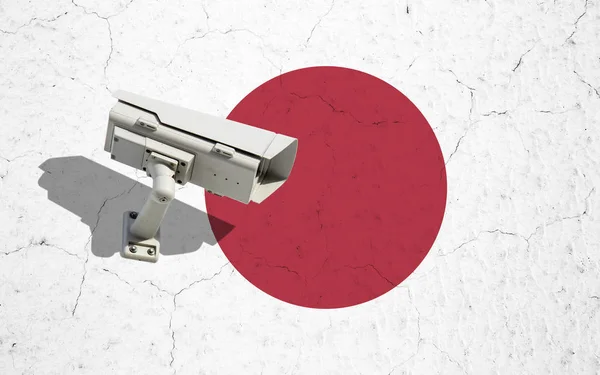 Камера видеонаблюдения на флаге Японии — стоковое фото