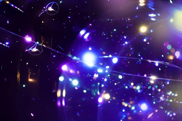 Colored lights on a dark background. Bokeh Festive abstract dark background. Space emulation — 스톡 사진