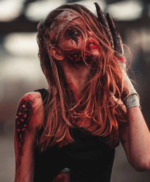 Mutant girl portrait in wounds and ulcers with nails in her head — Stock Photo, Image