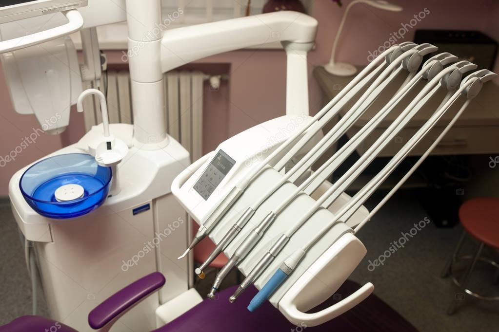 Dental unit, equipment, instruments and drills in modern dental  clinic. Close up.