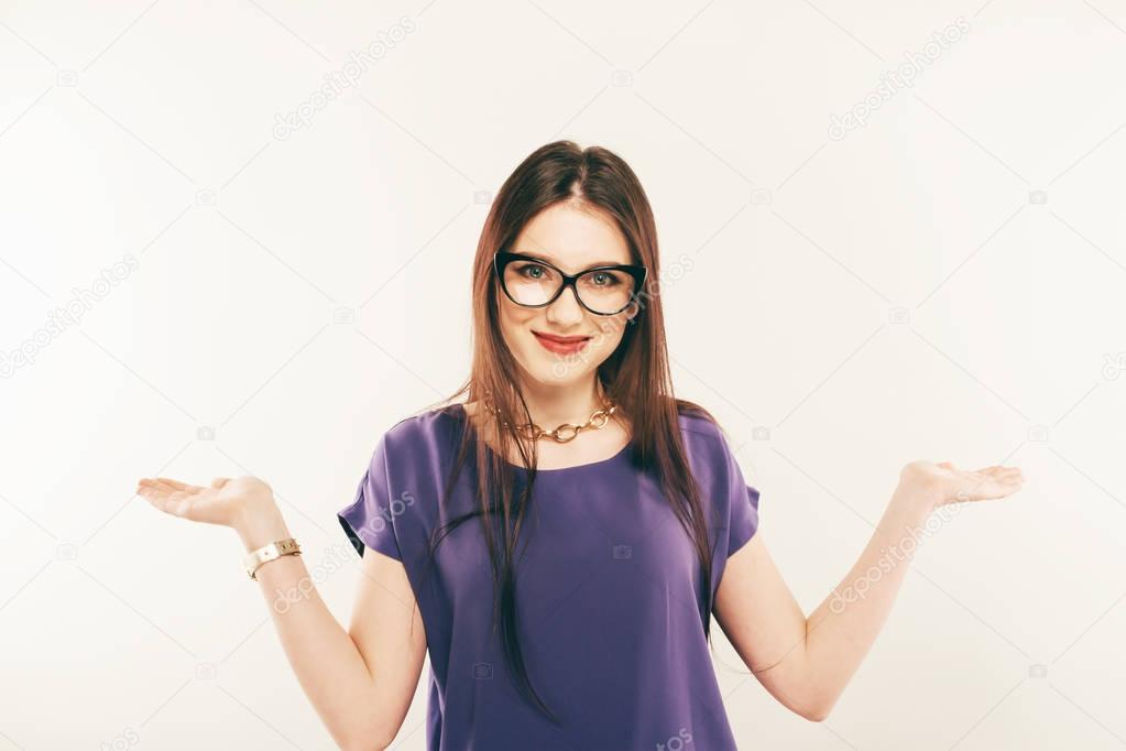 Portrait of a smiling woman wearing eye glasses. The palms in hand.